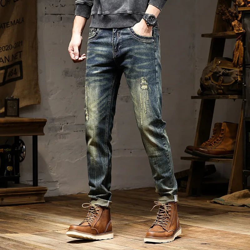 Men's skinny fit stretch jeans in a retro colour, showing zip fly and slim leg cut.