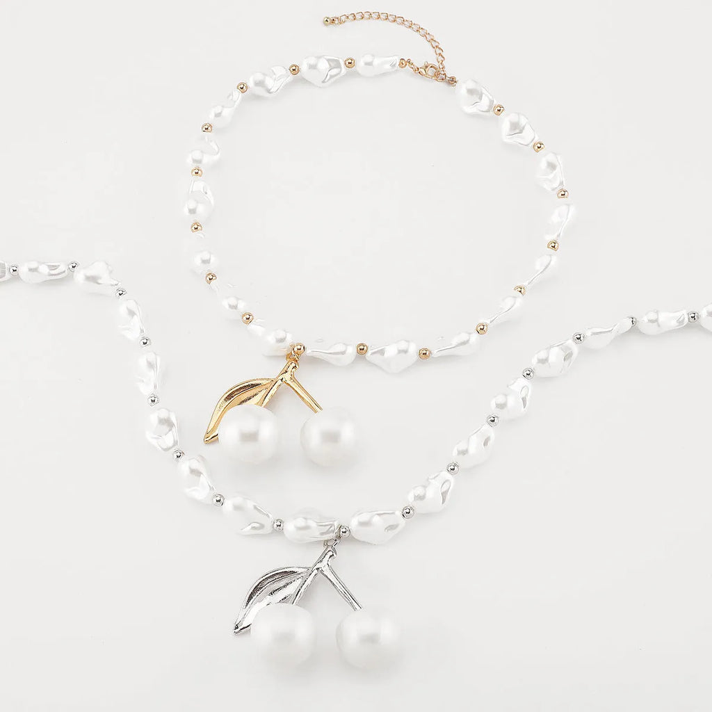 Women's geometric cherry fruit pendant necklace with pearl chain in gold or white K electroplated finish