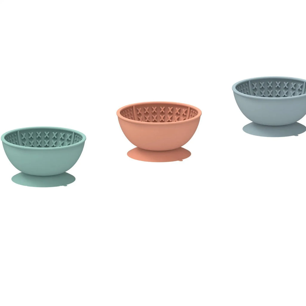 Cyan silicone pet bowl with textured licking mat surface and suction cup base