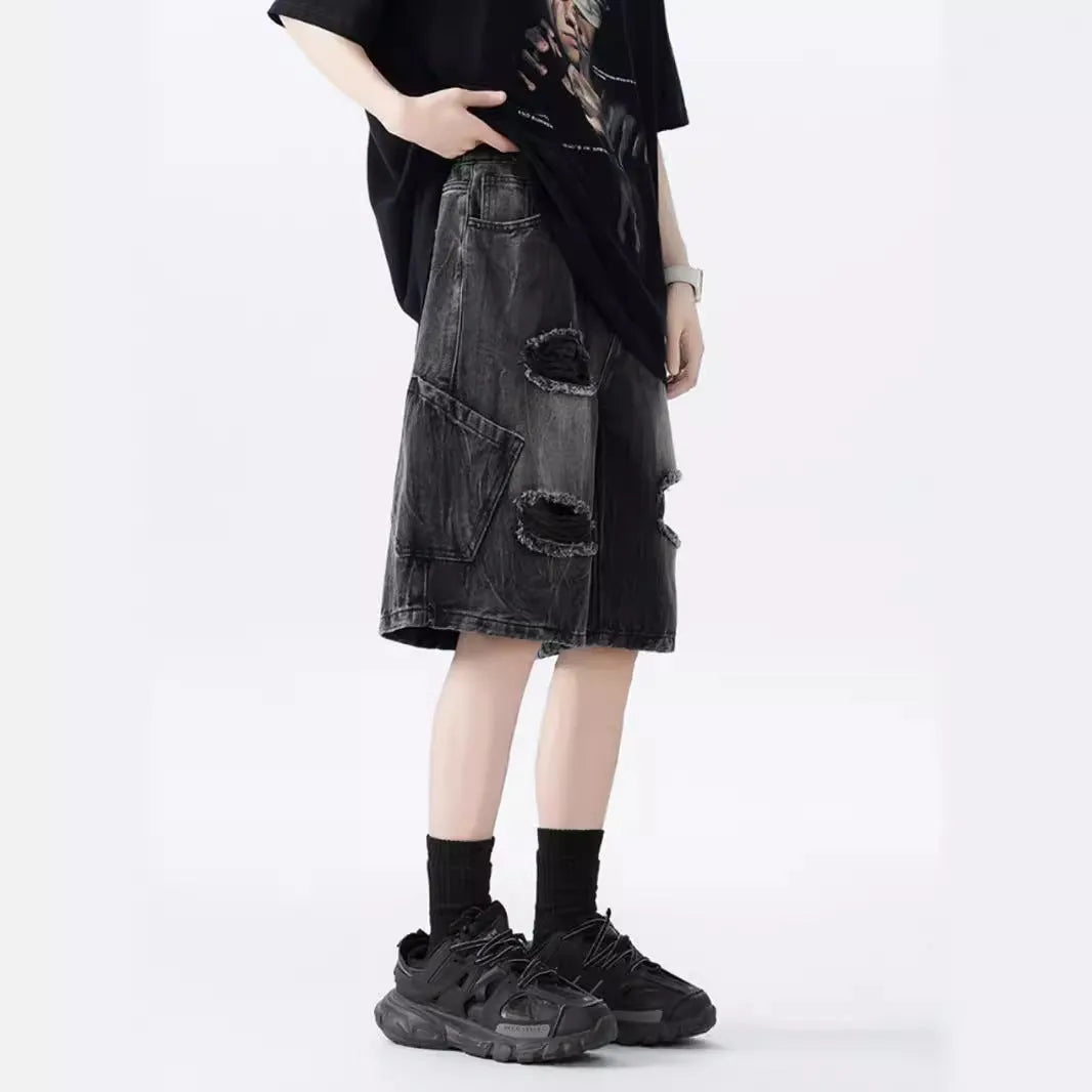 Men's vintage denim shorts with distressed detailing in loose fit design