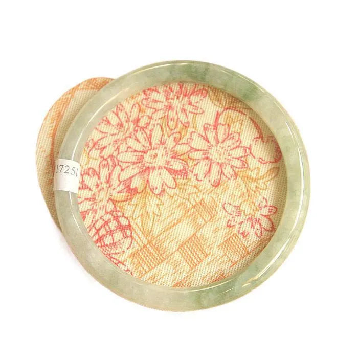 Green waxy jade geometric bracelet with Chinese-style design showing handmade construction