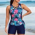 Plus size women wearing a floral printed high-waisted bikini in navy blue