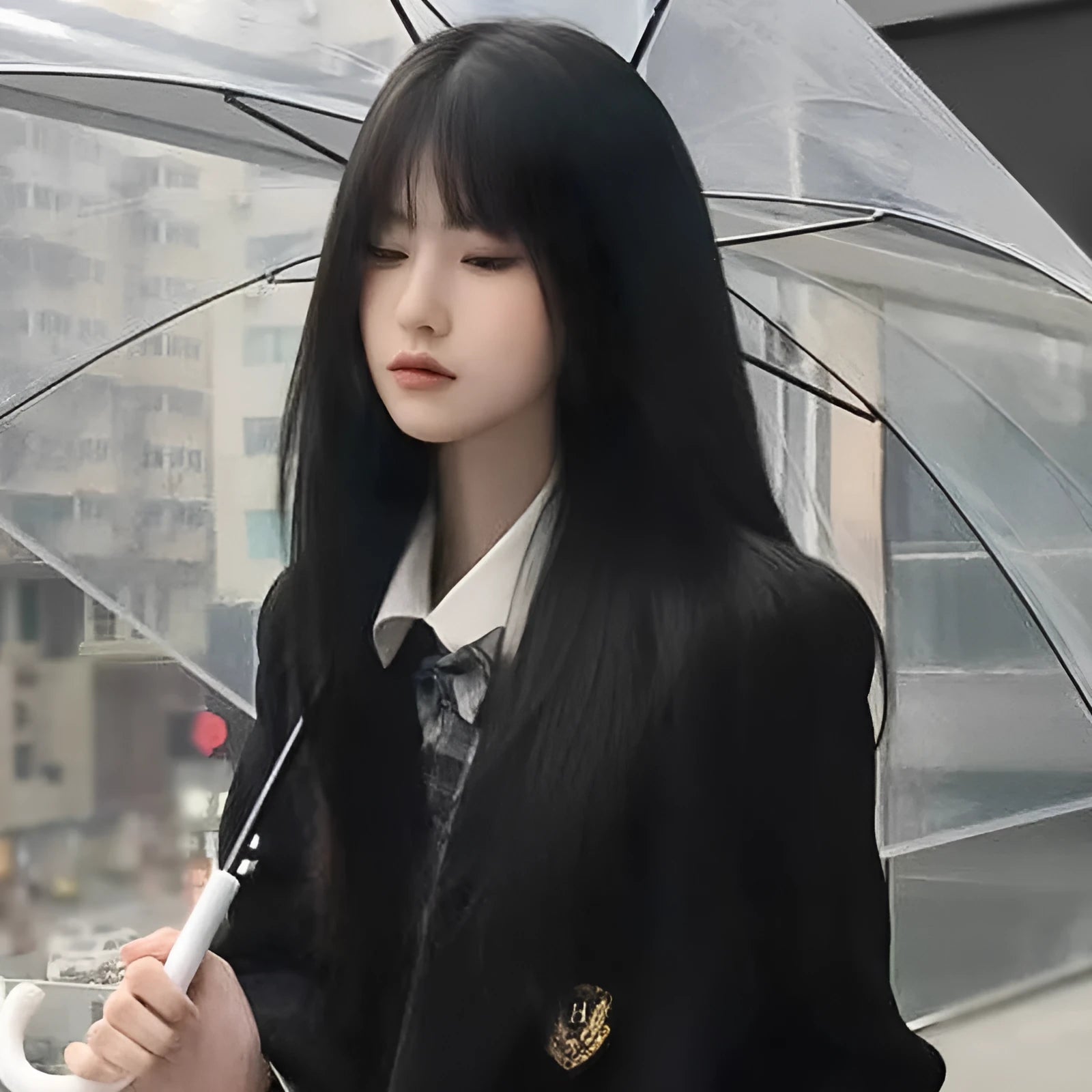 Long straight synthetic wig on a stand, shown in black colour with a full fringe.