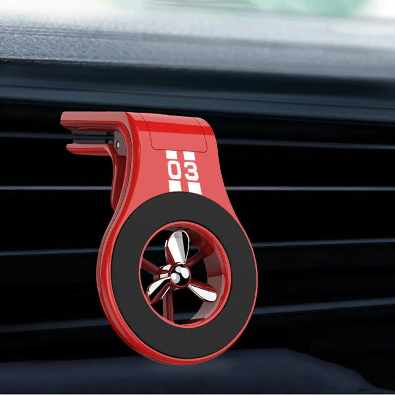 Black universal magnetic car phone holder clipped to a car air vent, holding a smartphone.