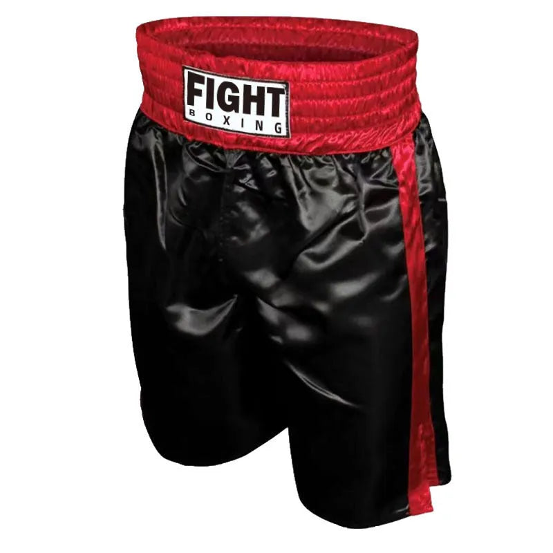 Man wearing black and white striped elastic waist kickboxing shorts in a training stance.