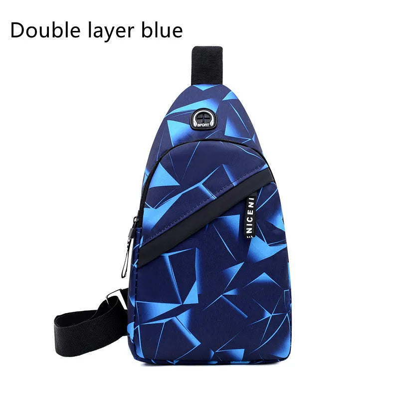 Men's blue Oxford cloth crossbody sling bag with earphone hole design showing zipper opening and letter print detail