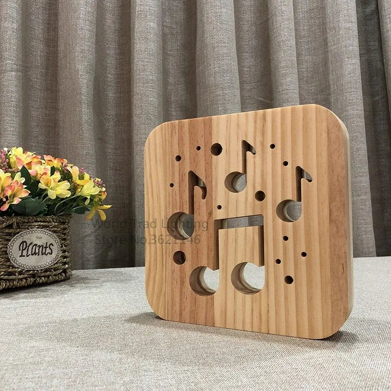 Square pine wood USB-powered LED lamp emitting warm white light on a desk.
