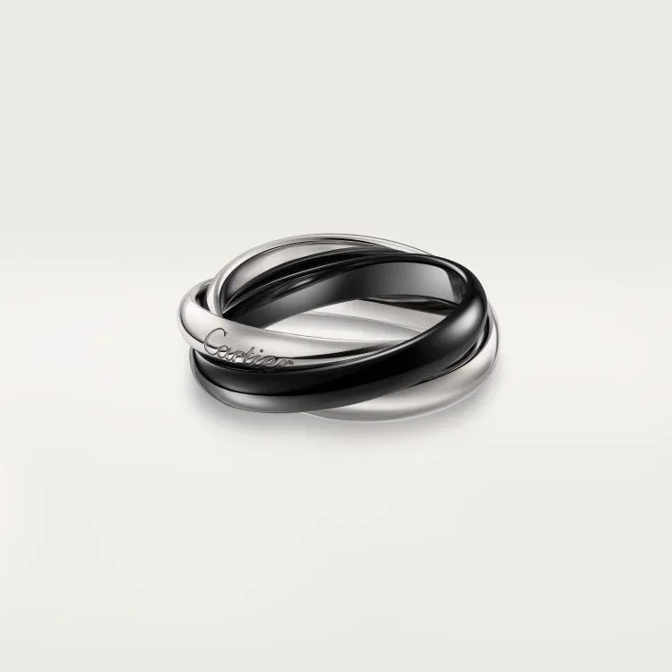 Geometric U-shaped silver couple ring with a full diamond band on a black background.