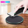 Black Qi wireless charging pad for iPhone 11 with soft silicone surface and LED indicator
