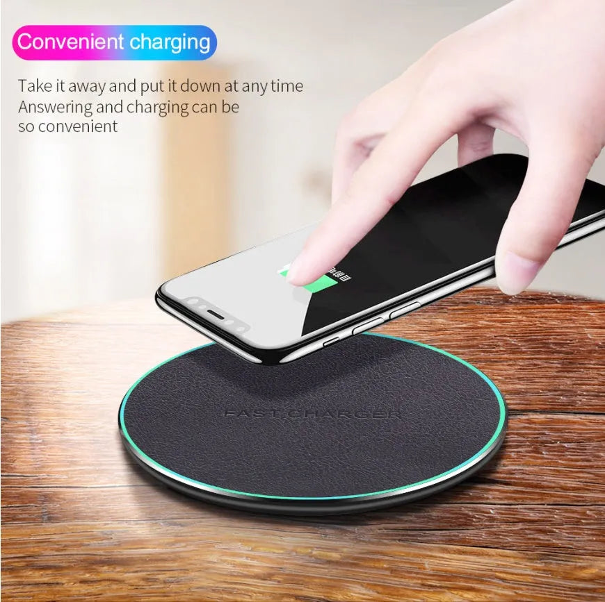 Black Qi wireless charging pad for iPhone 11 with soft silicone surface and LED indicator