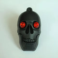 Halloween-themed skeleton skull USB flash drive with small chain in assorted colours.