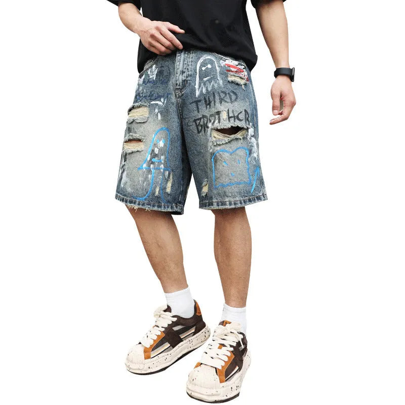 Blue men's ripped denim shorts with graffiti details and straight-leg cut