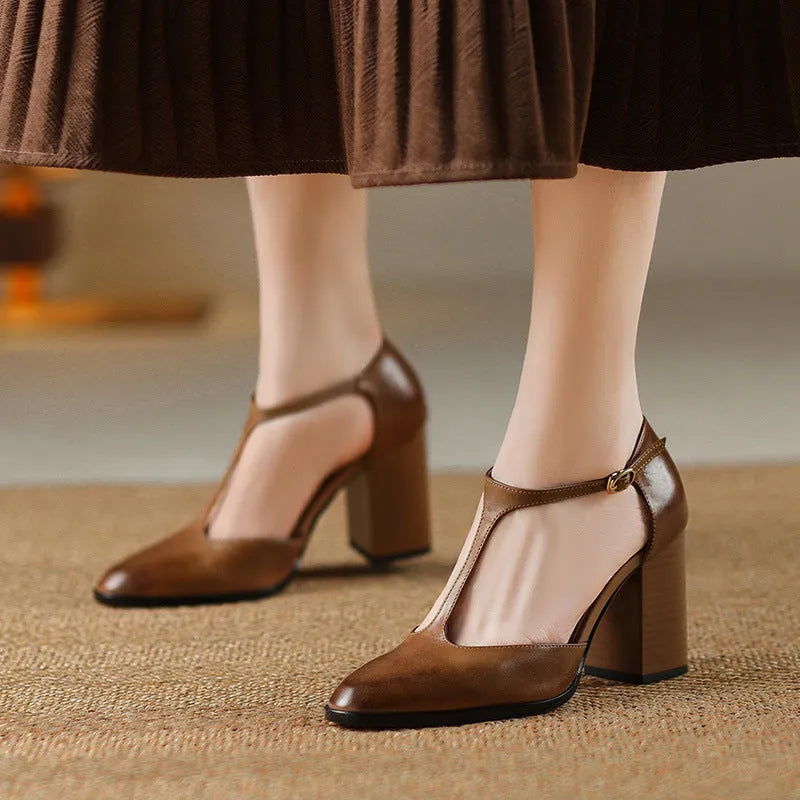 Women's dark brown retro pointed toe Mary Jane shoes with Baotou hollow design and a buckle strap.