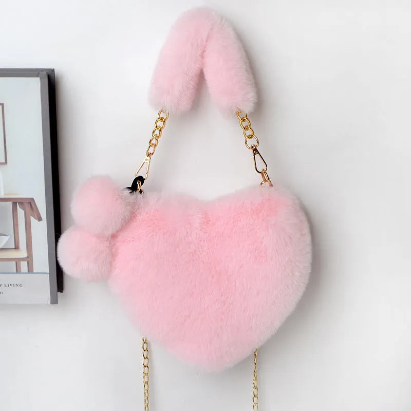 Soft plush heart-shaped women's handbag in medium size with zipper closure