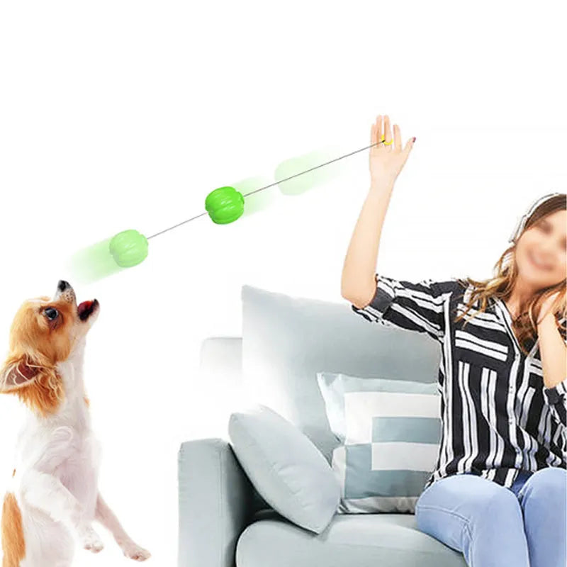 Green, orange, and yellow pumpkin-shaped squeaker dog ball toy for small dogs, shown with size scale.