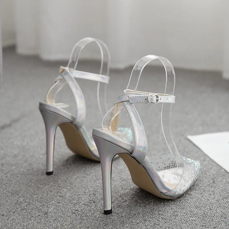 Women's pointed toe stiletto sandals with diamond detail on the PVC upper.