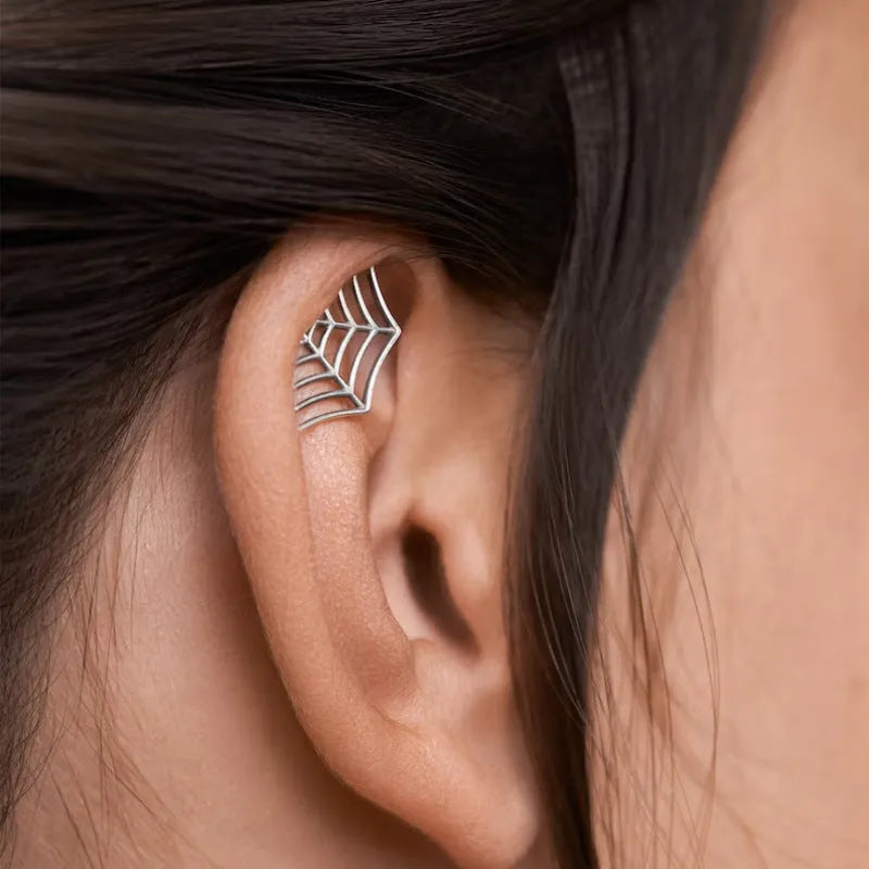 Spider web pattern stud earrings in electroplated gold and silver metal finishes
