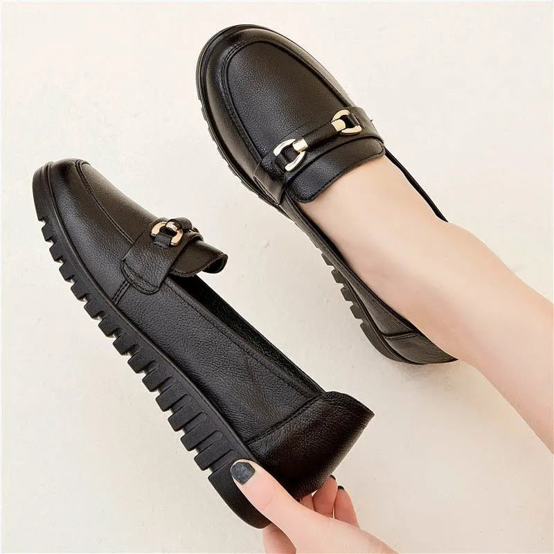 Black soft leather women's pumps with round toe and low flat heel