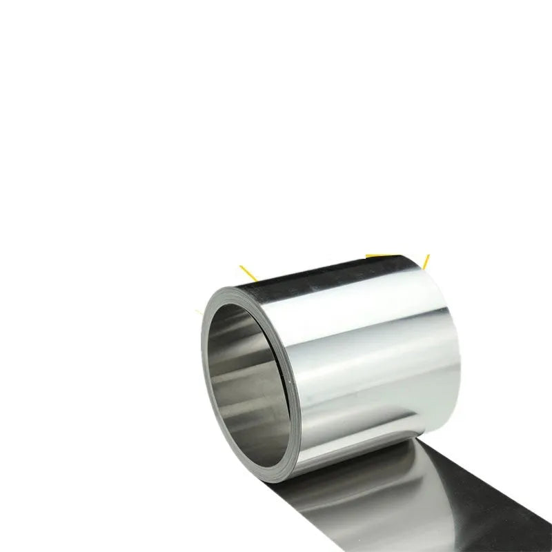 304 stainless steel metal shim strip on a workshop bench with a ruler showing its thin gauge.