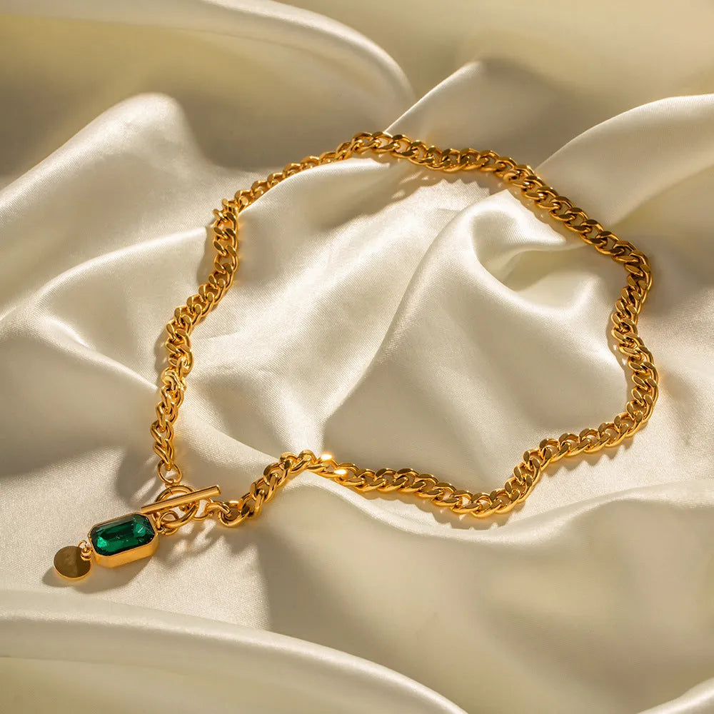 Gold titanium steel necklace with geometric emerald zircon pendant on Cuban link chain
