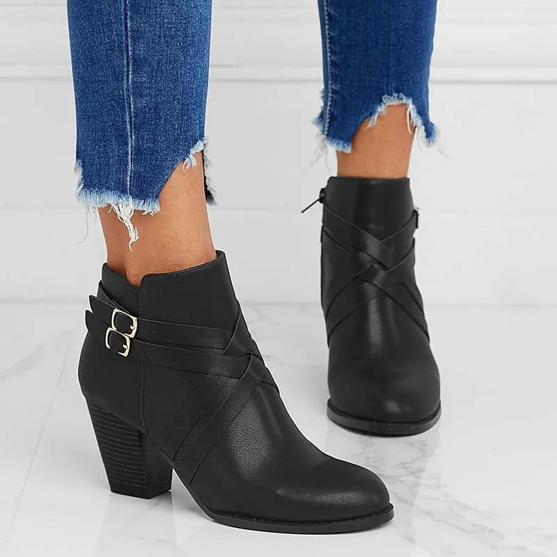 Women's grey PU leather ankle boot with a 7cm heel, side zipper, and belt buckle.