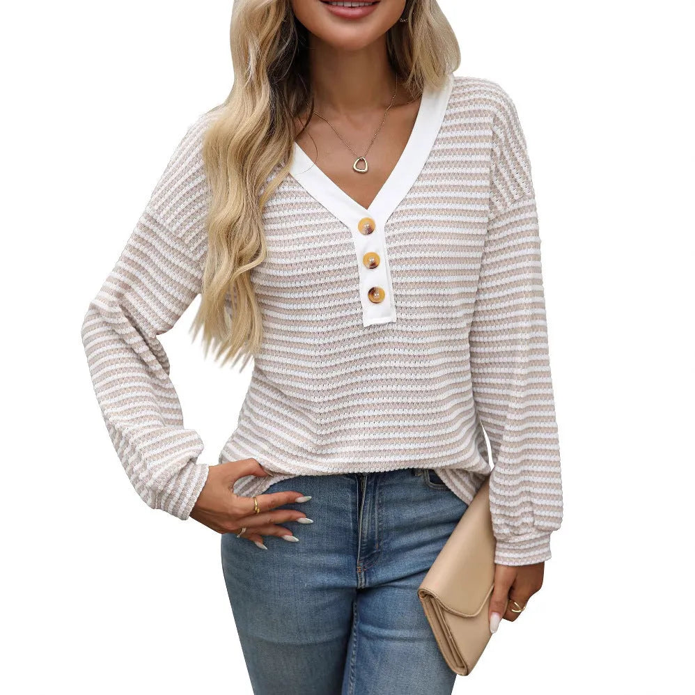 Women's loose fit patchwork V-neck pullover top with long sleeves and button fastenings.