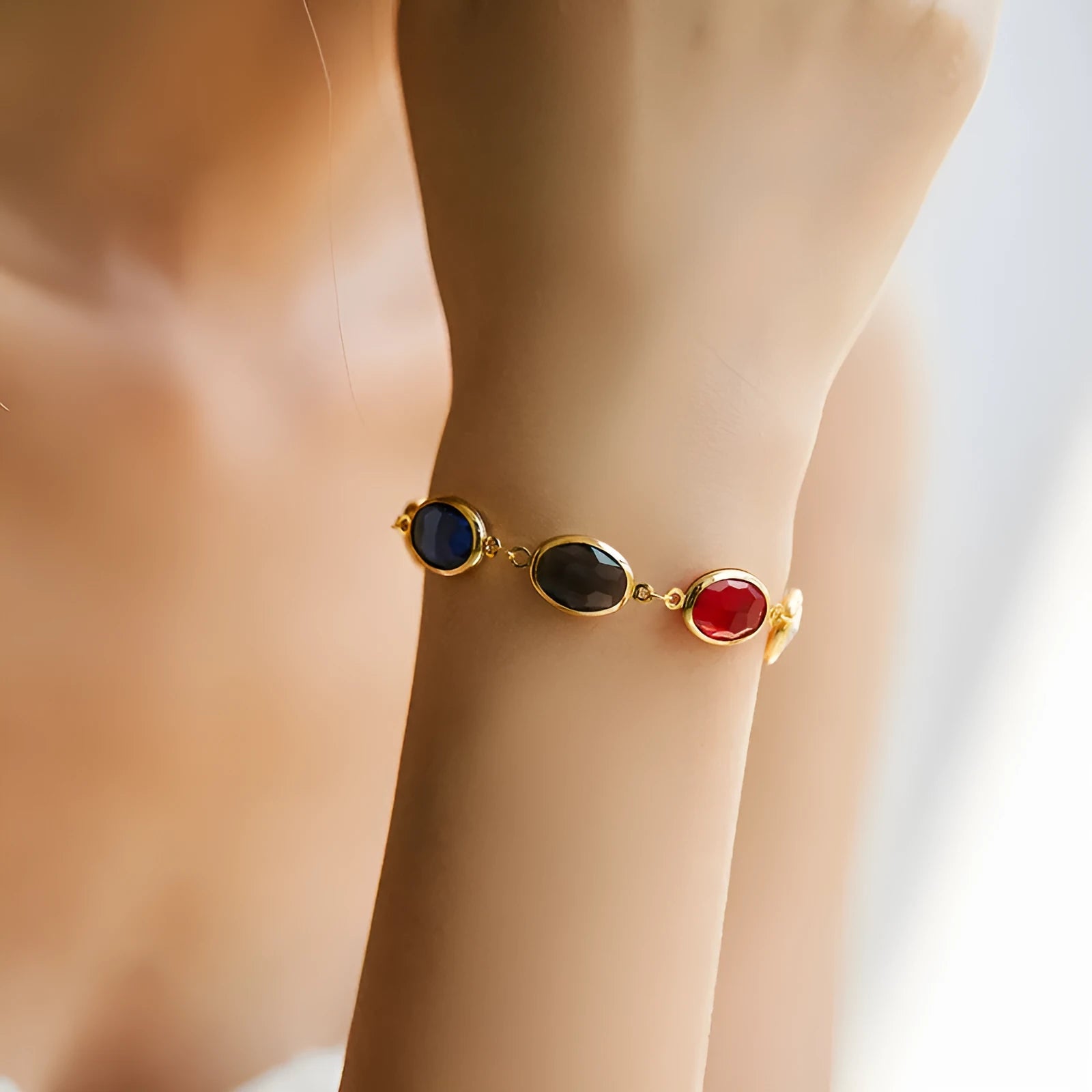 Women's geometric bracelet with elliptical glass inlays on 18K gold-copper framework