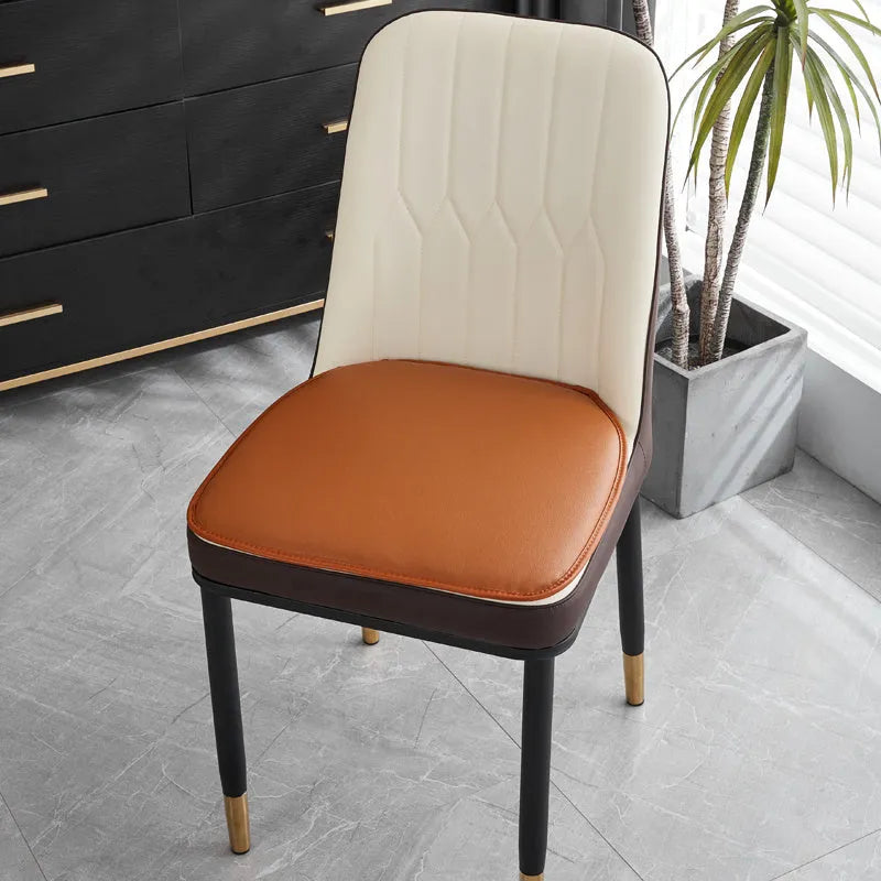 Leather horseshoe-shaped seat cushion in beige colour showing thickness and non-slip design