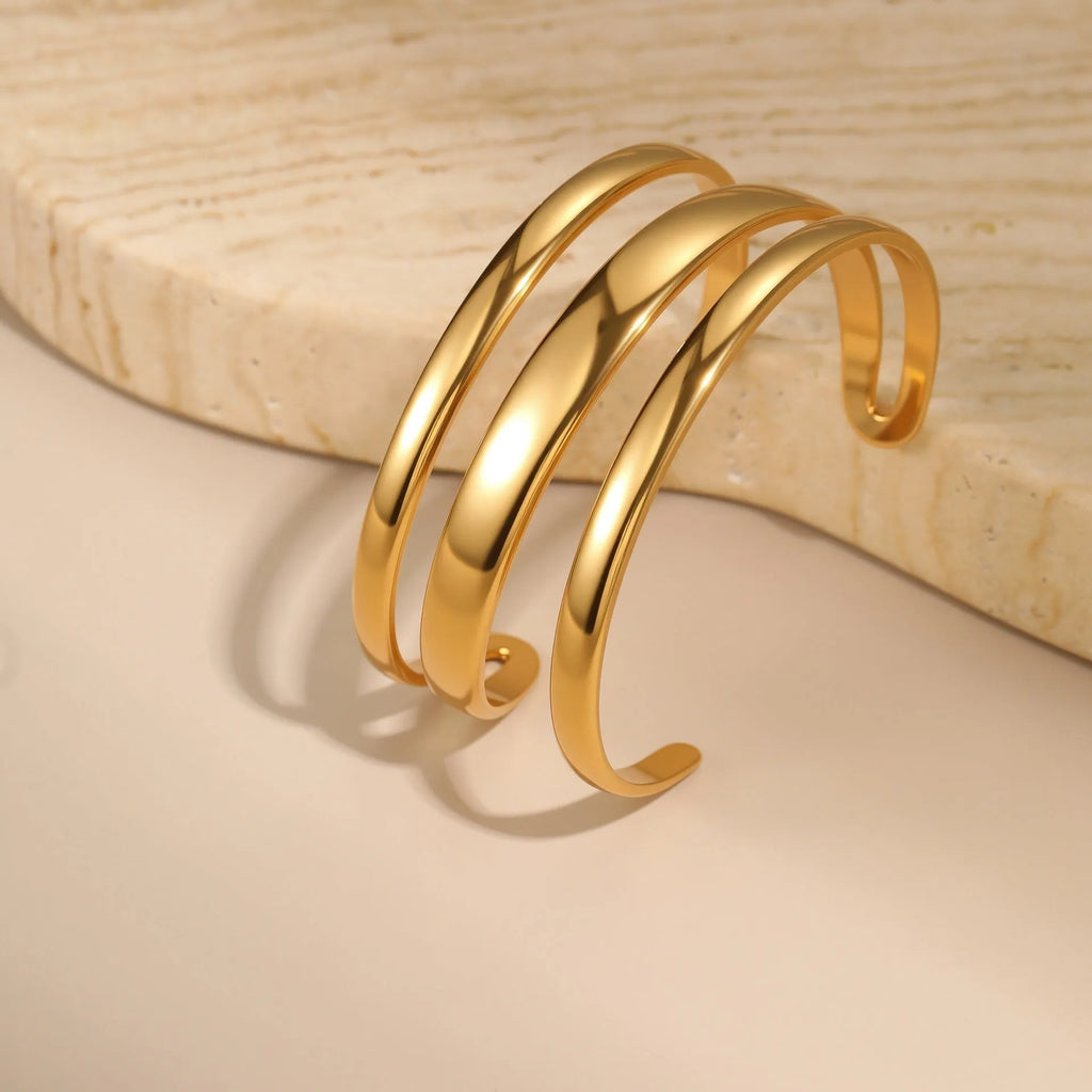 Women's stainless steel bracelet with 18K gold electroplating in geometric open design with line elements