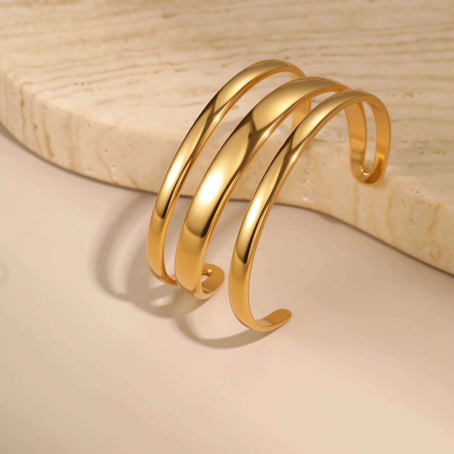 Women's stainless steel bracelet with 18K gold electroplating in geometric open design with line elements