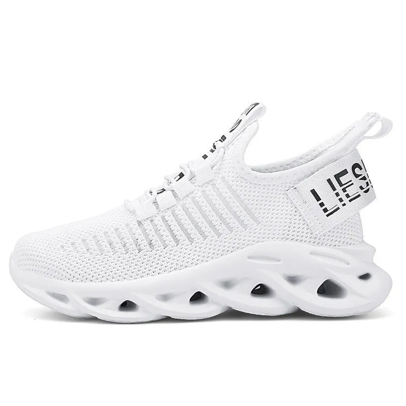 Kids black coconut sneakers with Velcro strap on a breathable fabric upper
