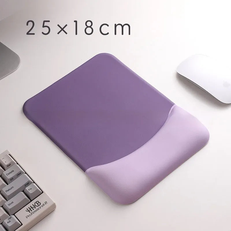 Square silicone wrist rest mouse pad with wrist strap in multiple colour options on a desk