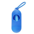 Compact black dog poop bag holder with hook and Velcro strap, shown attached to a pair of trousers.