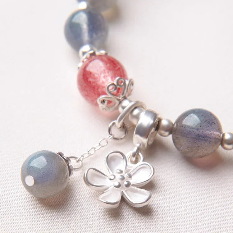 Grey moonlight gemstone women's bracelet with 7.5mm beads and a sterling silver honeysuckle charm.