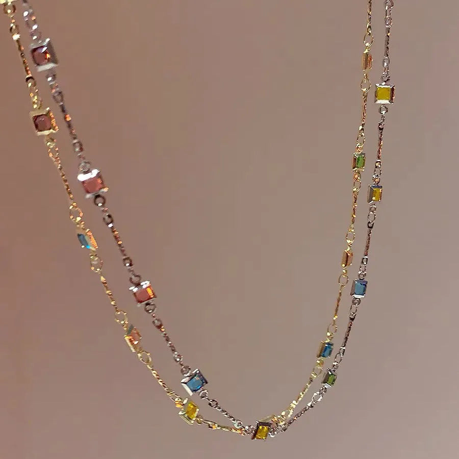 Square geometry clavicle chain necklace with artificial crystal and quadrilateral elements in gold finish