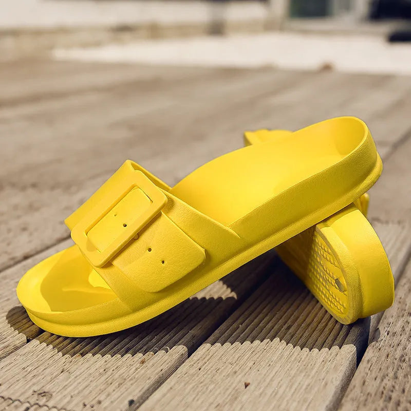 Grey Blue women's EVA flip-flop slippers with a silver buckle strap on a white background.
