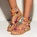 Women's Roman sandals with beaded petal design on artificial PU upper in round toe shape