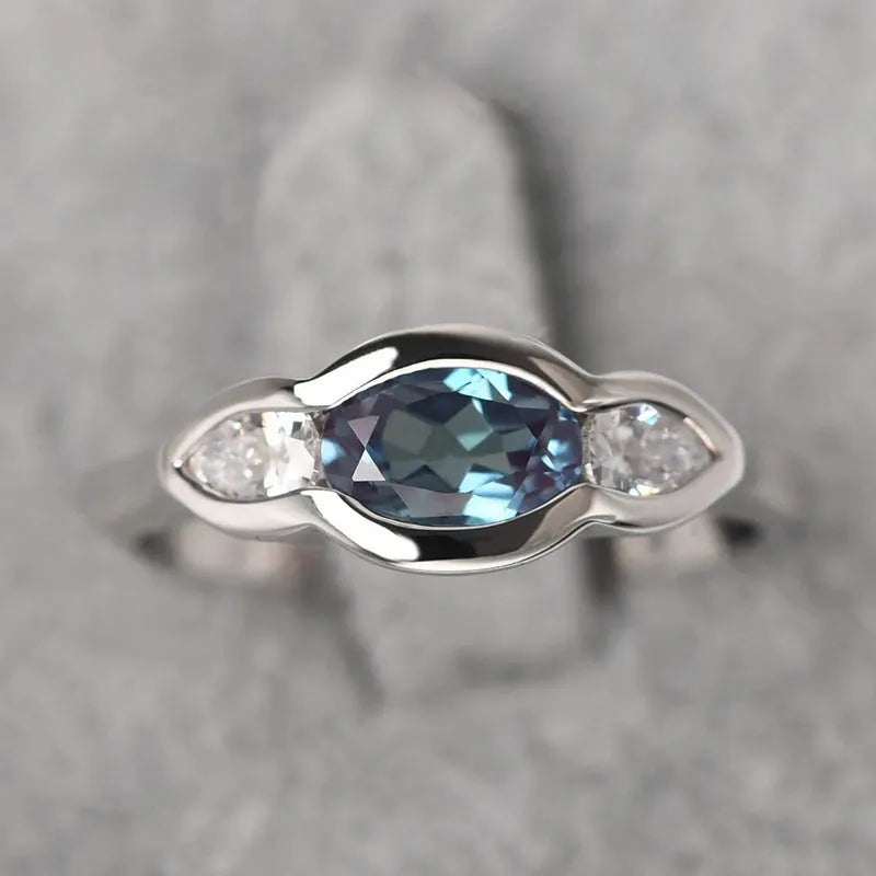 Women's geometric ellipse copper ring with white gold finish and inlaid zircon stones.