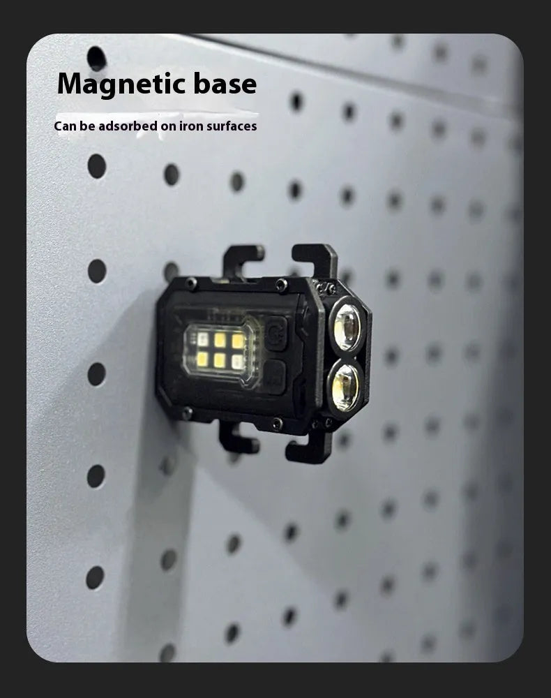 Portable mini tactical warning flashlight with USB charging cable on a backpack strap.