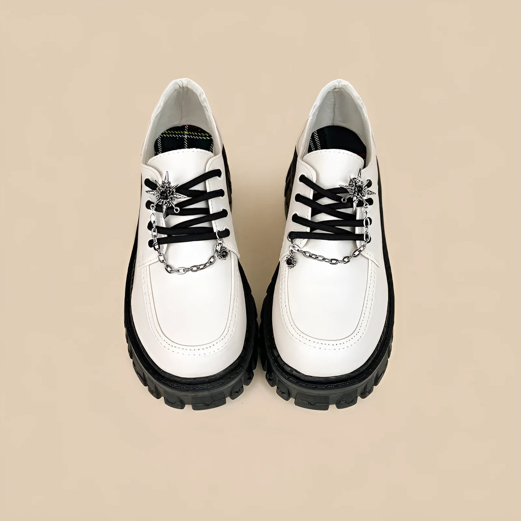 Women's Duke Asterism loafers with a metal cross strap and round toe in preppy style