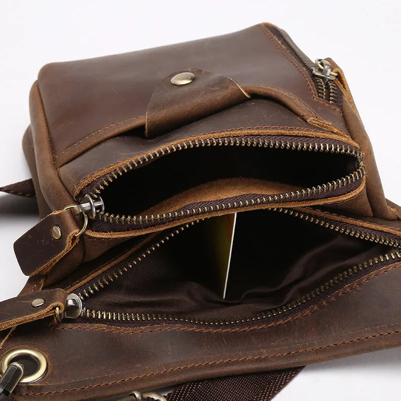 Men's brown crazy horse leather vintage satchel bag with a flap closure and adjustable shoulder strap.