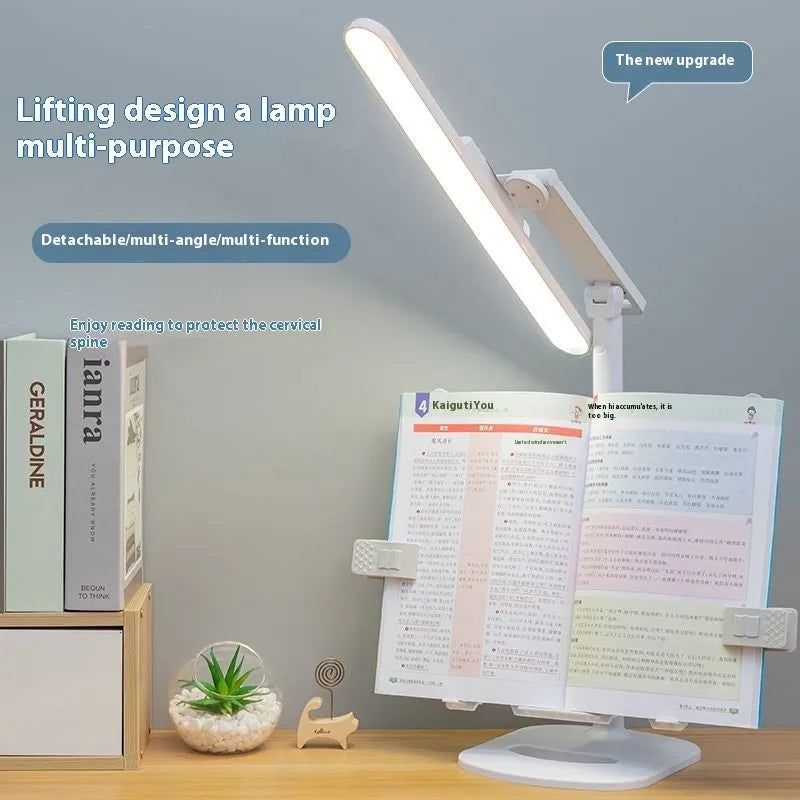 A white adjustable table lamp on a bookshelf with a flexible arm, showing a reading light in use.