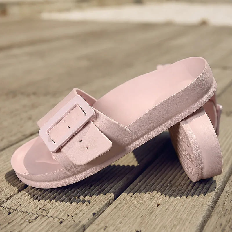 Grey Blue women's EVA flip-flop slippers with a silver buckle strap on a white background.