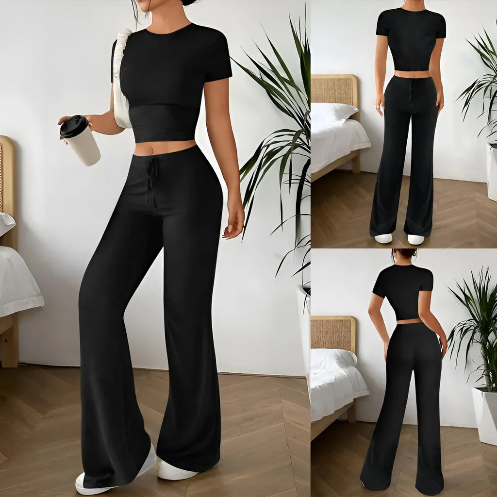 Black high waist trousers and short sleeve t-shirt matching set laid flat showing coordinated outfit