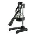 Manual citrus juicer with cast iron base and stainless steel strainer in black or white finish