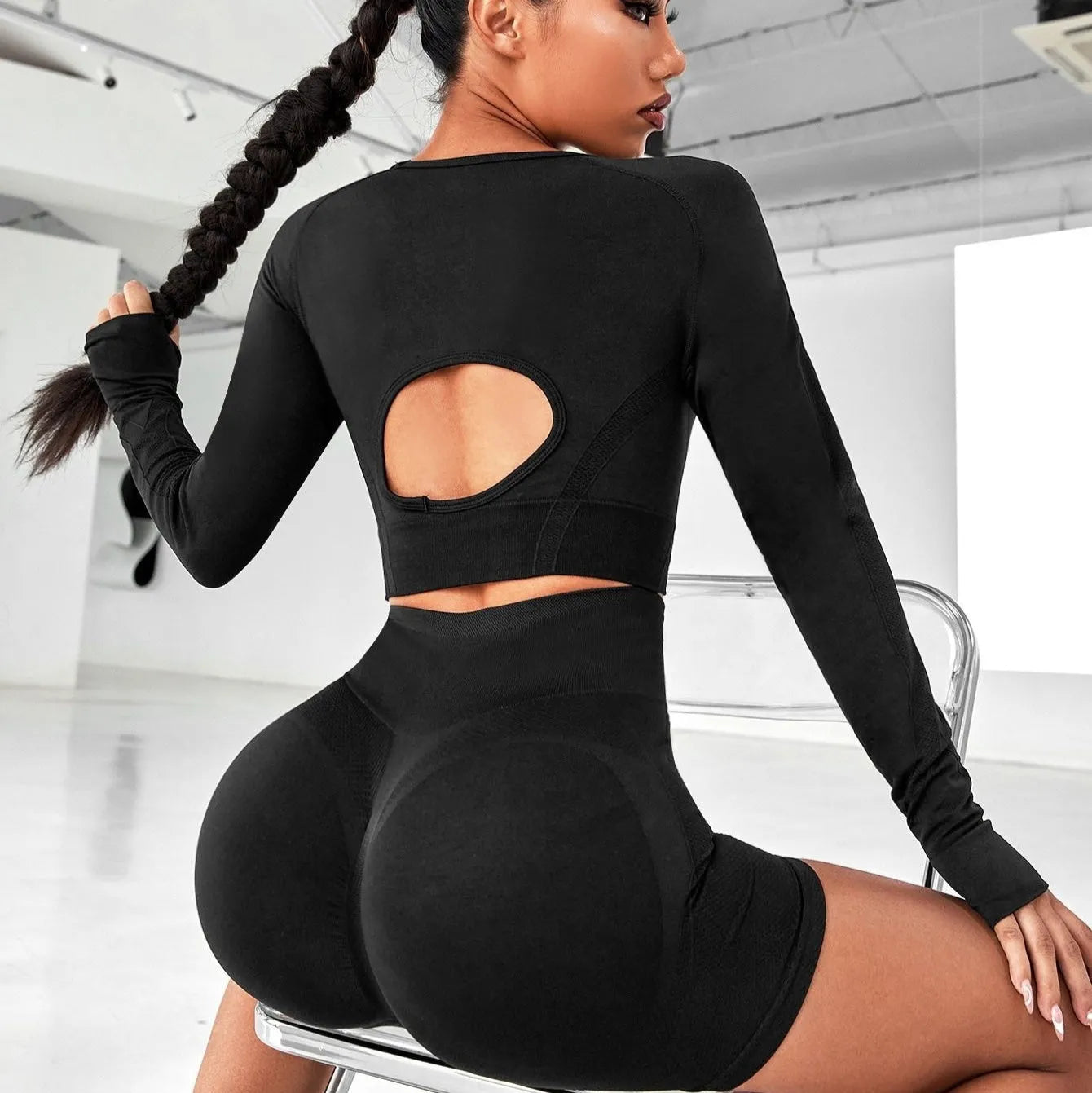 Women's black high waist yoga pants and long sleeve top set made from quick-dry fabric