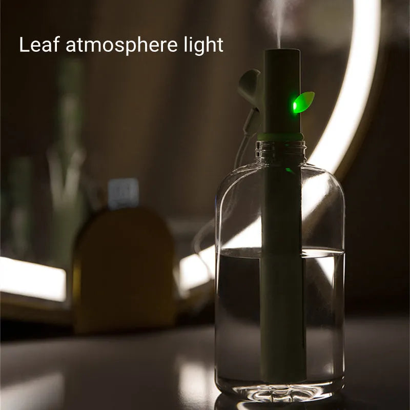Transparent portable USB humidifier with round design and water bottle attachment