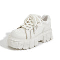 Women's beige leather muffin bottom casual slip-on shoes with a rubber foam sole.