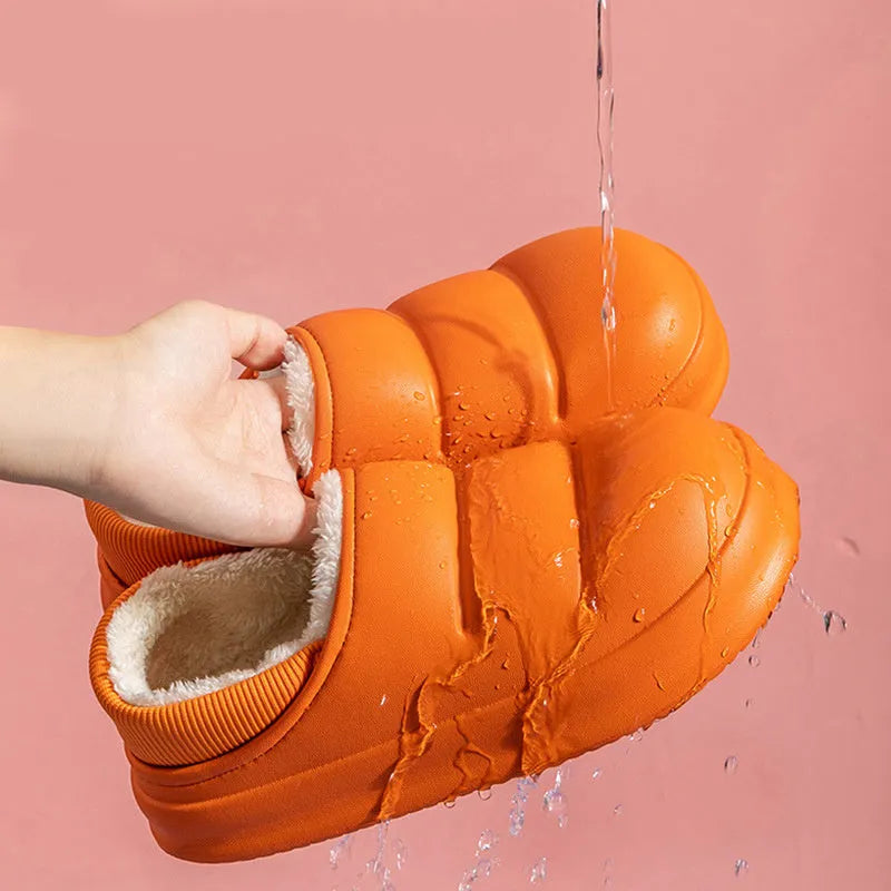 Yellow and green waterproof EVA winter house slippers with plush lining and non-slip sole.
