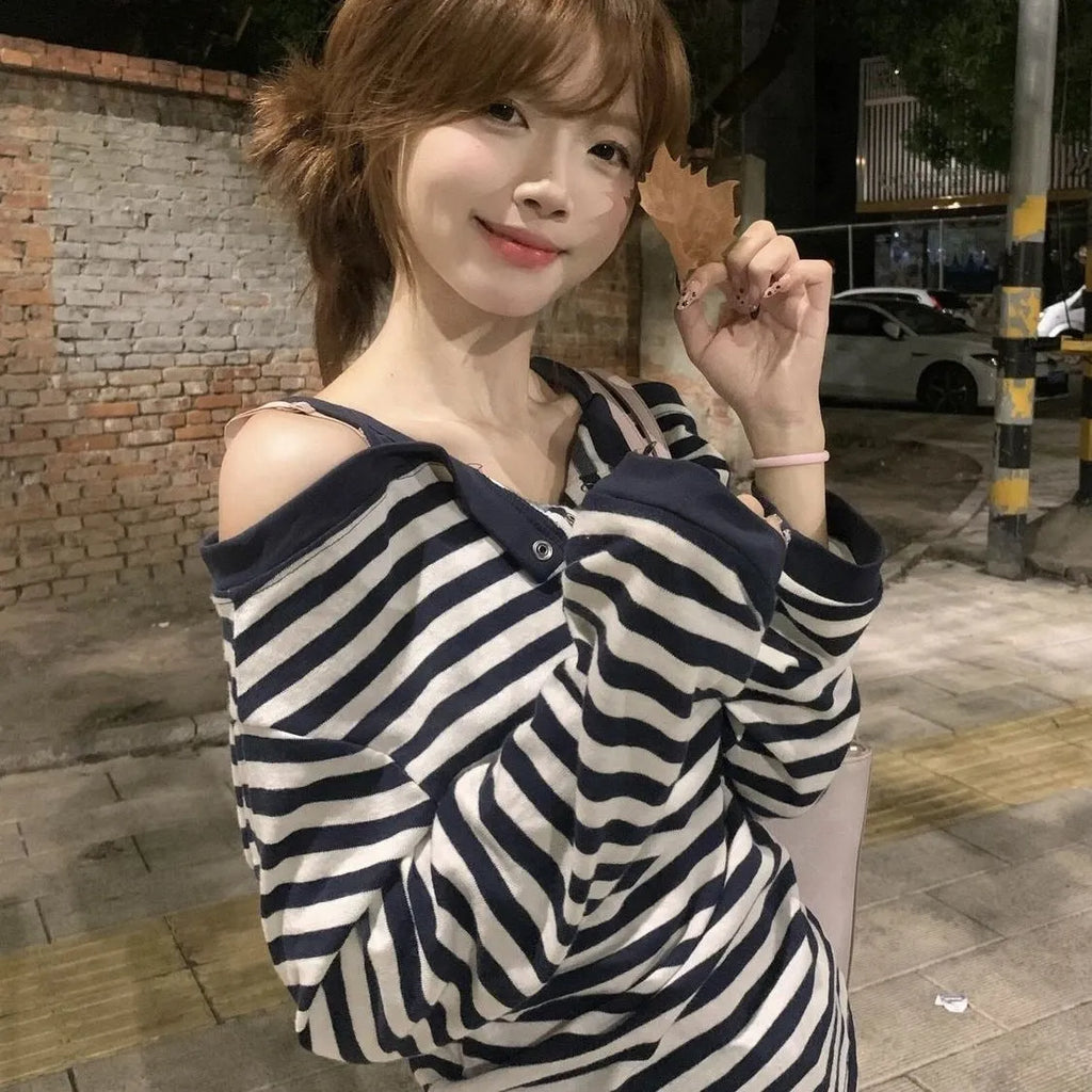 Dark blue Korean-style oversized women's long-sleeved T-shirt with embroidery, stripes, and button details on a soft viscose fabric.